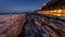 Passetto beach with typical fisherman caves in Ancona, at sunset