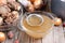 Passing the bone broth through a sieve. Concentrated Bone Broth in a bowl on the table