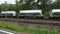 Passing freight and passenger trains - tracking shot