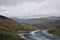 Passing place on a mountain road - moor, hills, low misty cloud and a valley in the distance