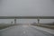 Passing under a bridge on an highway, rainy days, car driving through water from the storm, bad weather