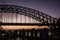 Passing under Sydney Harbour Bridge at sunrise, Australia