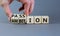Passion or ambition symbol. Businessman turns wooden cubes and changes the word `ambition` to `passion`. Beautiful grey table,