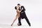 Passion. Elegant couple of dancers in vintage evening dress and suit dancing retro ballroom dance. Love and music