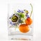 Passion flowers and fruit in vase