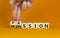 Passion or profession symbol. Businessman turns wooden cubes and changes the word profession to passion. Beautiful orange table,