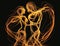 Passion Two entwined figures move in a graceful and passionate dance creating sparks of emotion. Art concept. AI