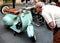 A passionate admires an Vespa rally