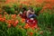 Passionate couple on spring field. Lovers in flowers. Inspiration from nature. Sensual concept. Love story.
