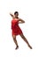 Passionate dancer in red dress with fringe looking at camera while performing tango on white background