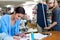 Passionate fashion creators. Cropped shot of two young seamstresses working together in their fabric shop.