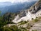 PASSO DEL VESTITO, MASSA CARRARA, ITALY - JULY 5, 2019: Stunning view looking down over white marble quarry, high up in