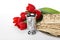 Passover matzos, silver goblet and flowers on background. Pesach celebration