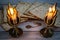 Passover matzos, two candlesticks with burning candles, and star of David necklace