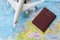 Passport, airplane and map
