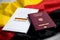 Passport and  constitution basic law book of Germany with flag on marble background