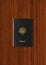 Passport isolated on dark wooden background