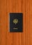Passport isolated on dark wooden background