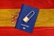 Passport and padlock on the background of the Spanish flag. Ban on leaving the country. Travel abroad is closed. Spanish flag and