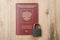 Passport with a padlock. Concept of banning visits to other countries during a pandemic. Symbol of restriction of travel