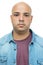 Passport photo of serious bald adult man