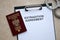 Passport of Poland and Extradition Agreement with handcuffs on table