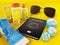 Passport, sunglasses, sunbed, sun cream, globes and towel. 3D illustration