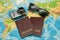 Passport, world map, glasses, camera. Travel concept