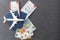 Passports, boarding passes and toy airplane on gray table