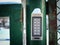 Password code security keypad system number combination to unlock the green iron gates outside the house in winter snow
