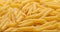 pasta backgroud - macro view of Dry Authentic Italian penne