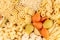 Pasta background assortment of different kinds italian macaroni in chess cells top view.