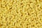 Pasta background, delicious popular food. Pasta â€” a product of dried wheat dough with a round cross section. Pasta is widely