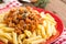 Pasta bolognese. Spaghetti served with a sauce of ground beef meat, tomato, onion, carrot and thyme