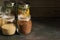 Pasta, buckwheat, quinoa and chickpeas in a glass jar on a dark rustic background. Selective focus, copy space