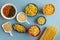 pasta in ceramic and wooden bowl. penne, spaghetti, farfalle tonde, butterfly, auger, couscous, colorful pasta, barley noodle,