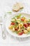 Pasta with cherry tomatoes, arugula and Parmesan