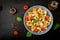 Pasta colored farfalle salad with tomatoes