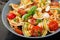 Pasta colored farfalle salad with tomatoes