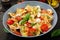 Pasta colored farfalle salad with tomatoes