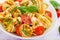 Pasta colored farfalle salad with tomatoes