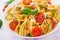 Pasta colored farfalle salad with tomatoes