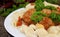 Pasta Conchiglie and meatballs with tomato sauce on rustic wooden background. Soft focus