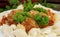 Pasta Conchiglie and meatballs with tomato sauce on rustic wooden background. Soft focus