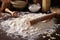 pasta dough and rolling pin on flour-dusted surface