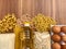 Pasta, eggs, chickpeas, rice, oatmeal and sunflower oil set on a wooden background, donation set. necessary products