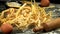 Pasta falls on the table with flour. Filmed on a high-speed camera at 1000 fps.