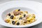 pasta farfalle with tuna, black olives and corn