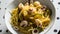 Pasta frutti di mare with calamari and vegetables.