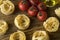 Pasta ingridients and spice on wooden surface.